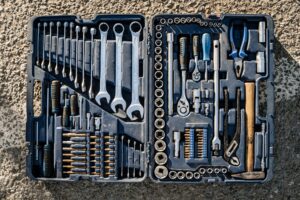 Flat lay of an organised toolbox with a small set of essential hand tools