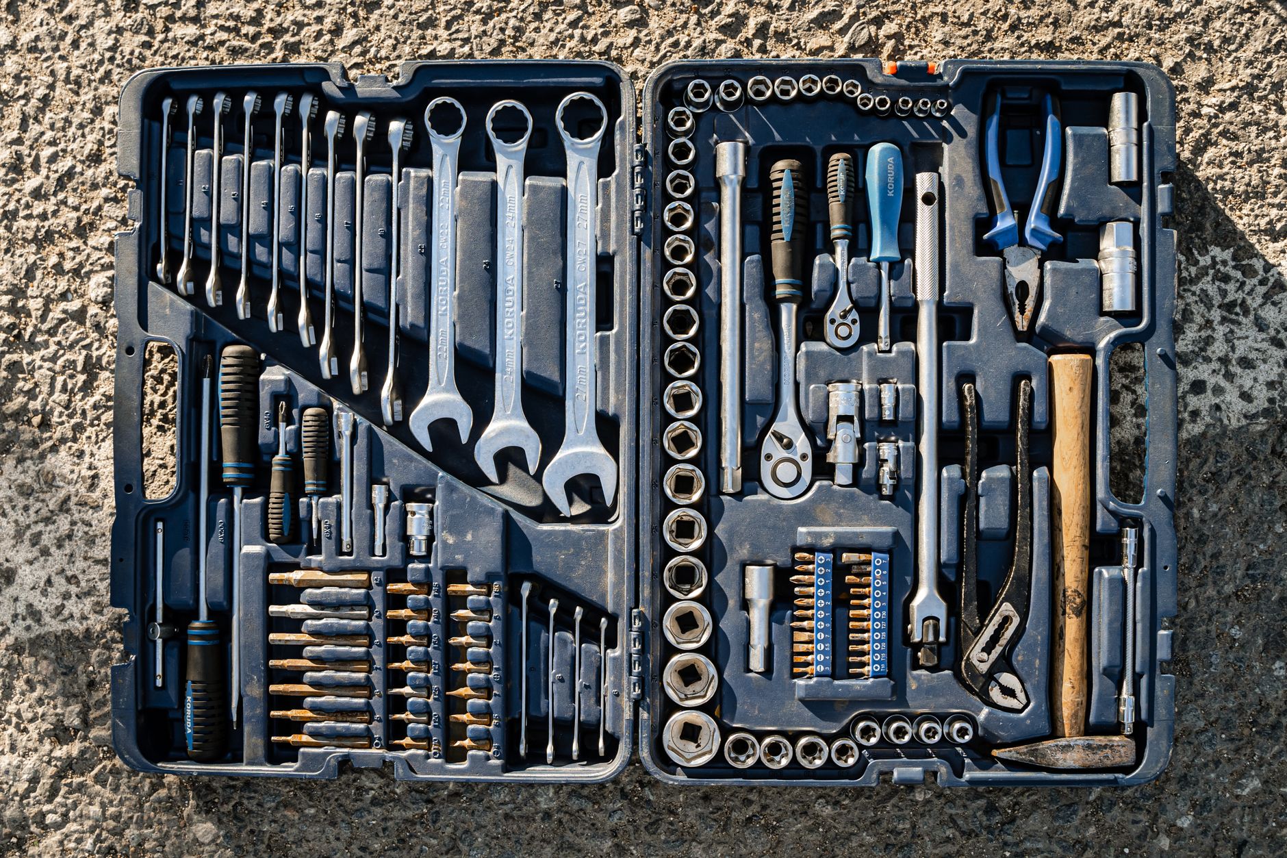 Flat lay of an organised toolbox with a small set of essential hand tools